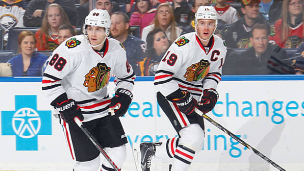 patrick-kane-jon-toews-2.jpg